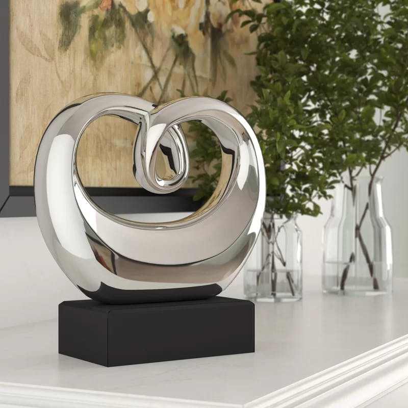 Elegant Silver Swirl 13" Ceramic Abstract Statue with Black Base