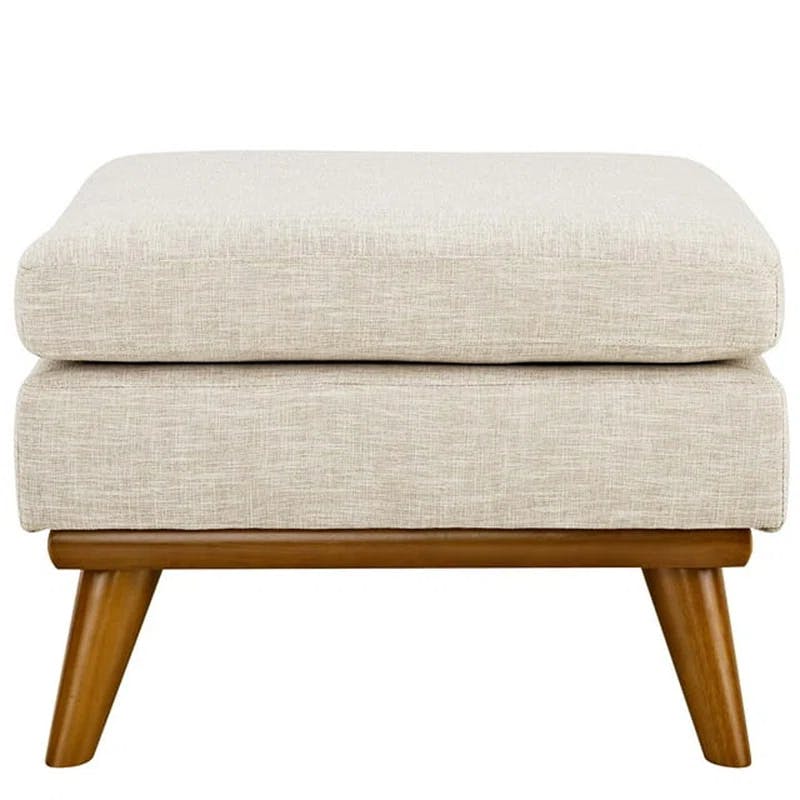 Plush Beige Fabric Ottoman with Sloping Curves and Solid Rubberwood Base