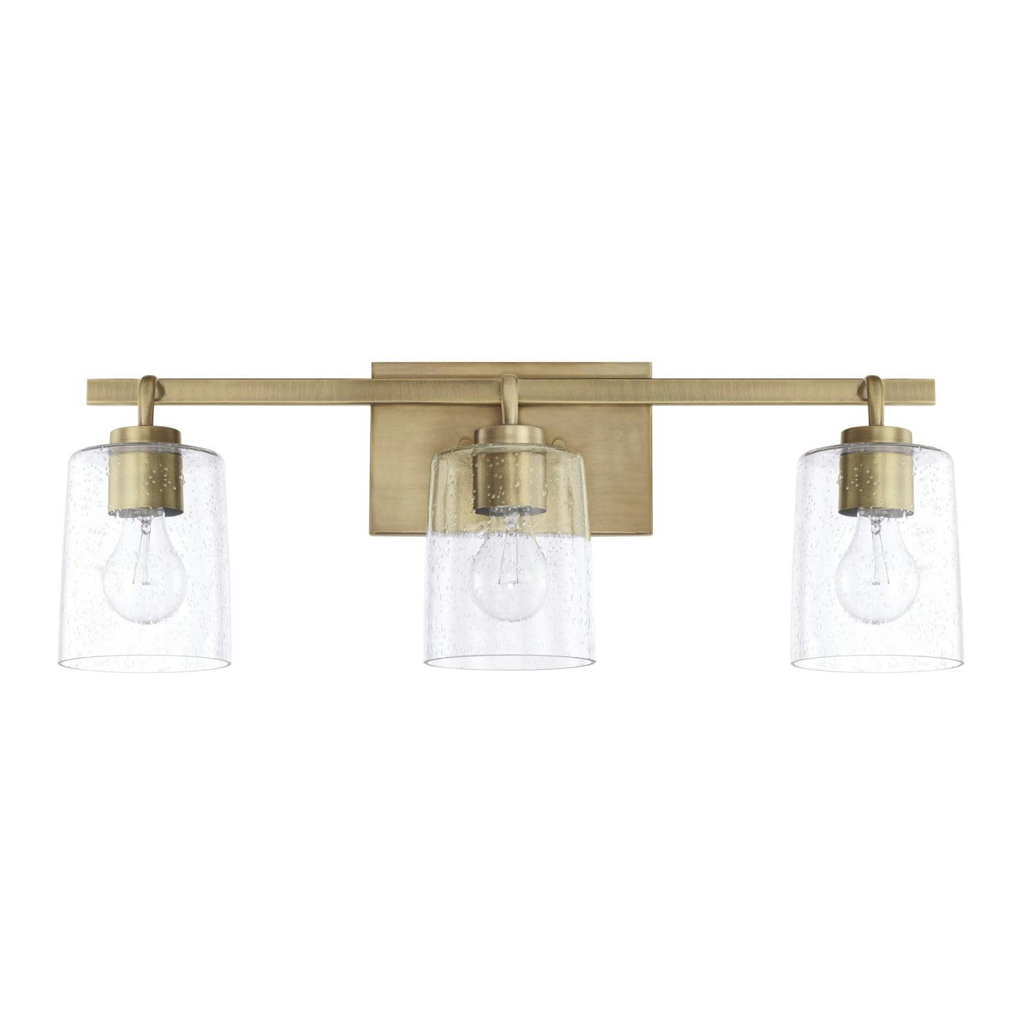 Elegant Greyson 3-Light Vanity in Aged Brass with Seeded Glass Shades