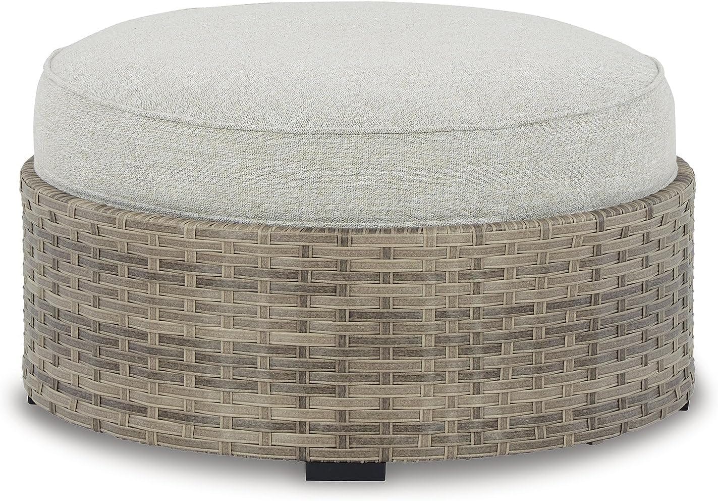 Calworth Handwoven Wicker Outdoor Ottoman with Performance Beige Cushion