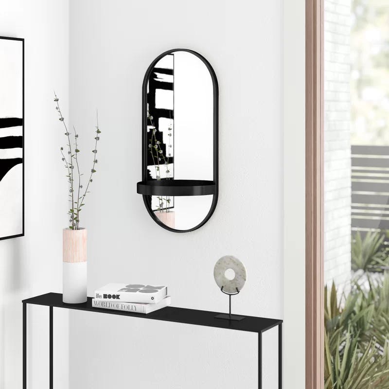 Estero 16" x 38" Black Metal Oval Wall Mirror with Shelf