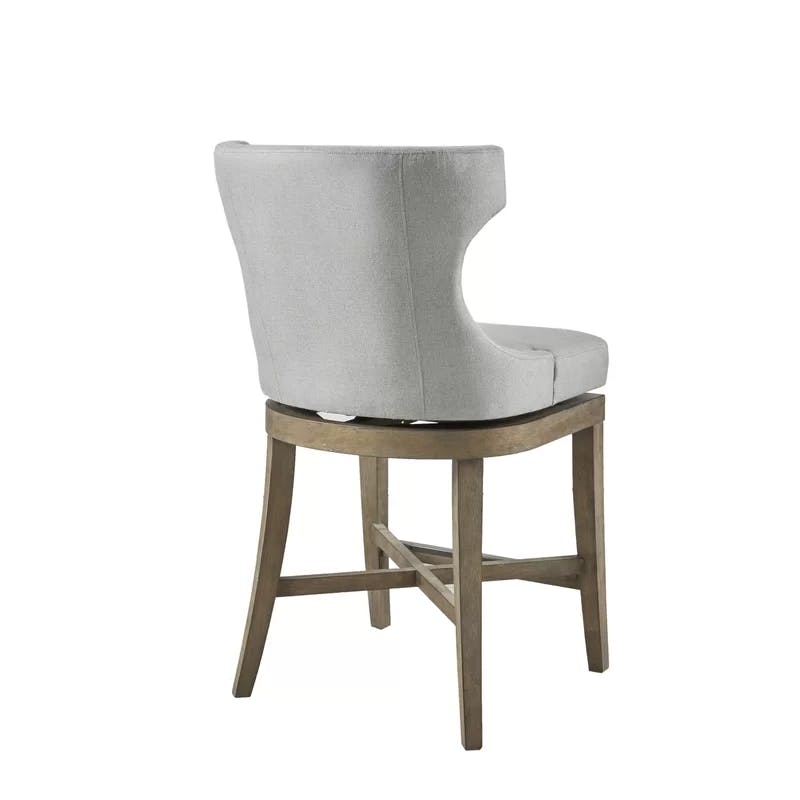 Elegant Light Grey Wingback Swivel Counter Stool with Bronze Accents