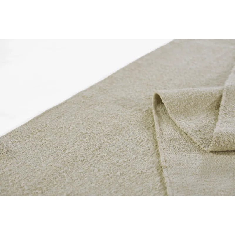 Koukila Ivory Solid Handwoven Wool 6' x 9' Area Rug