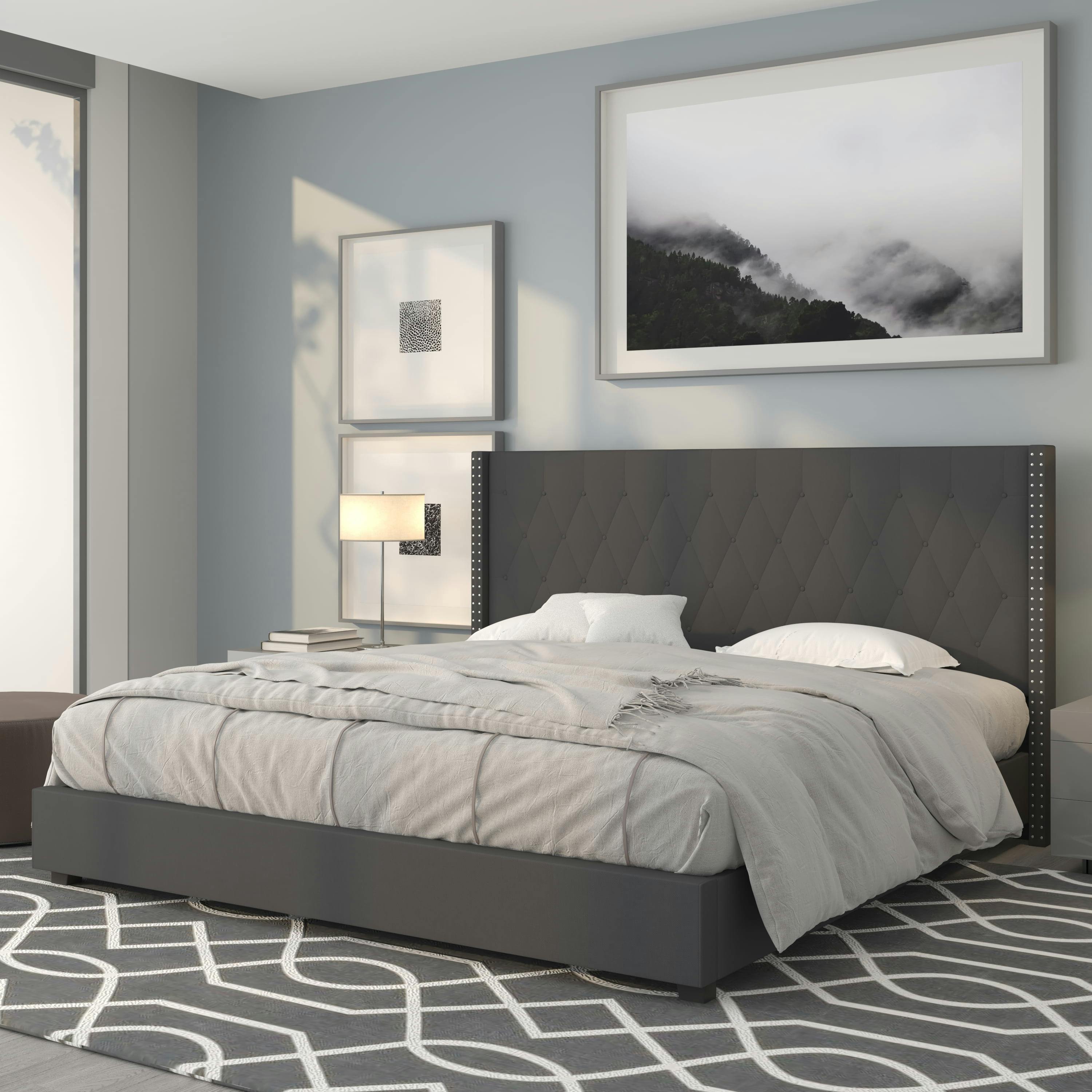 King-Sized Dark Gray Upholstered Platform Bed with Nailhead Trim